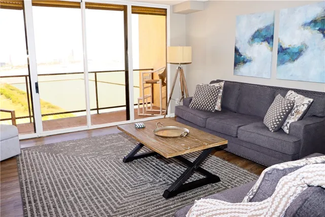 a living room with a couch and a window