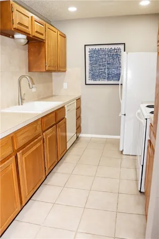 a bathroom with a sink a vanity and a shower