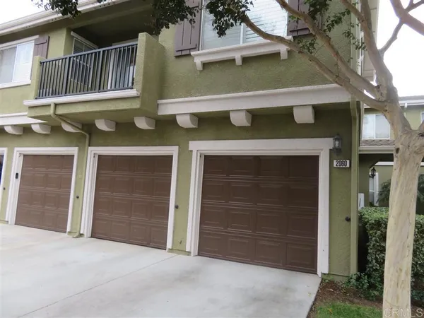a front view of a house with a garage