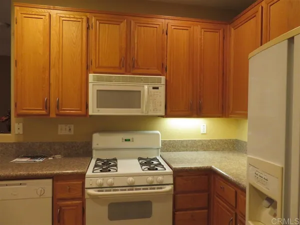 a kitchen with a stove and a cabinets