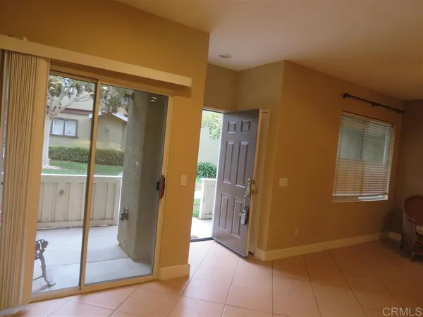 a view of a hallway with bathroom