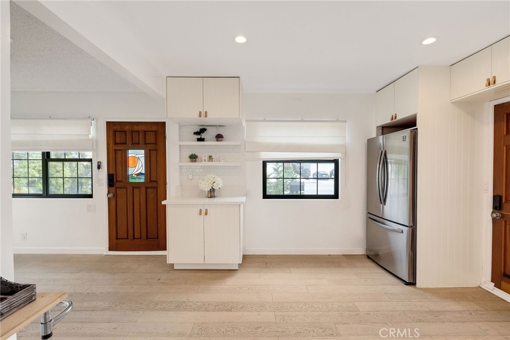 207 South Aviation Boulevard Manhattan Beach, CA 90266 - Photo 11 of 29 a view of kitchen with a refrigerator cabinets and a window