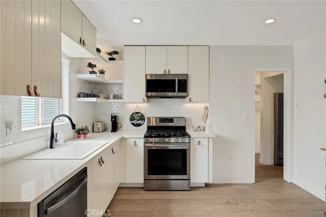 a kitchen with a stove and a refrigerator
