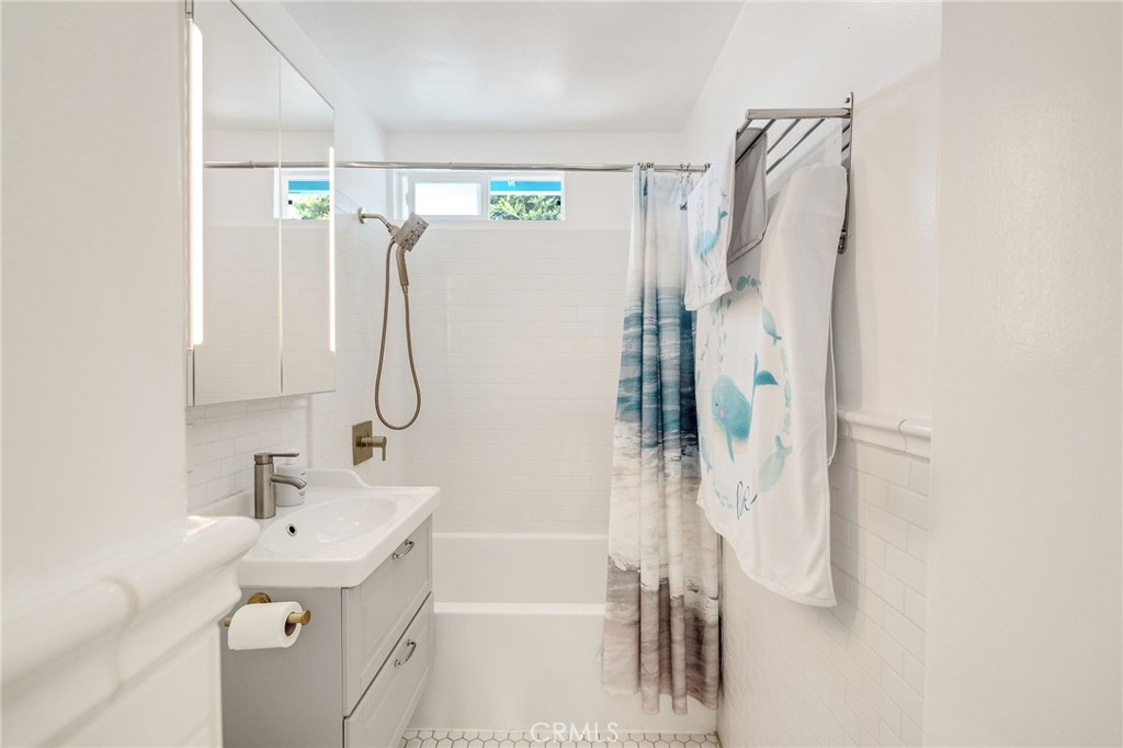 207 South Aviation Boulevard Manhattan Beach, CA 90266 - Photo 17 of 29 a bathroom with a sink vanity and shower
