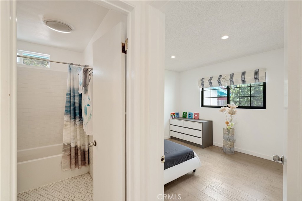 207 South Aviation Boulevard Manhattan Beach, CA 90266 - Photo 18 of 29 a bedroom with a bed and a window