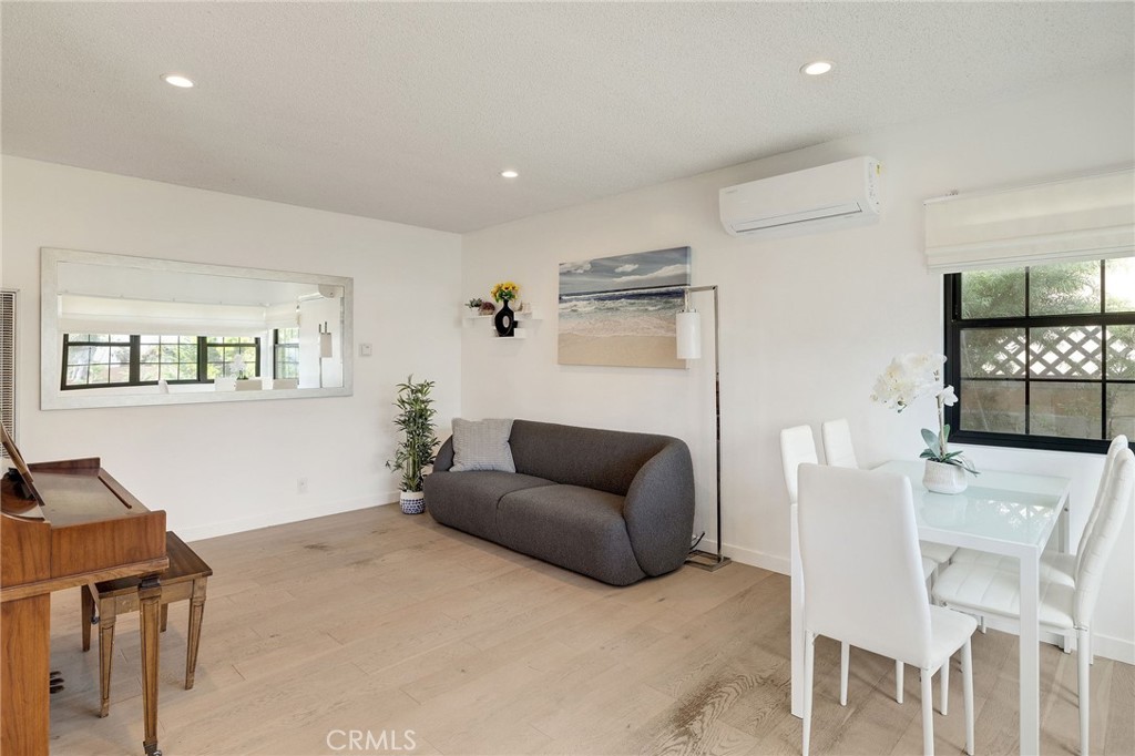 207 South Aviation Boulevard Manhattan Beach, CA 90266 - Photo 6 of 29 a living room with furniture and a wooden floor