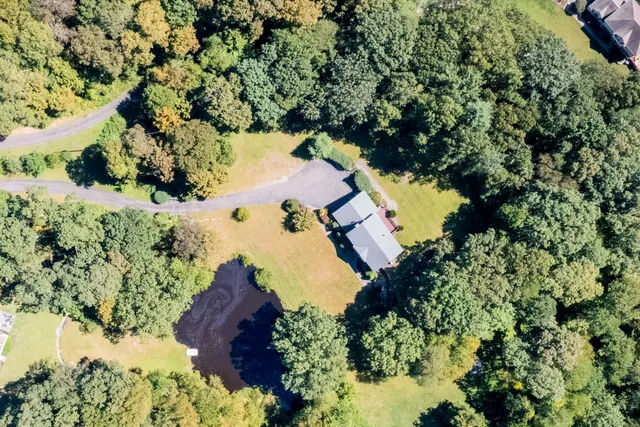 an aerial view of residential houses with outdoor space