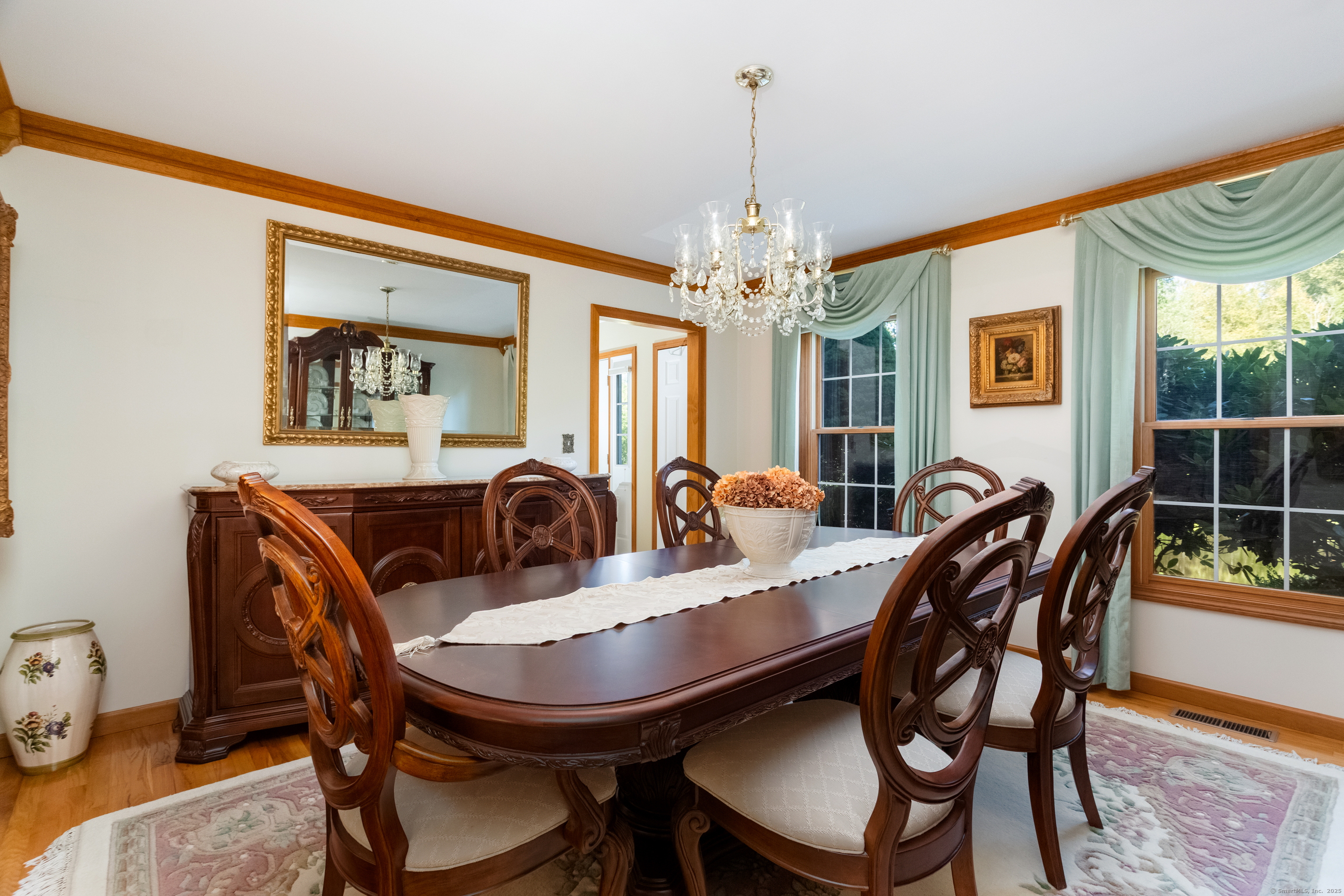 491 Hammertown Road Monroe, CT 06468 - Photo 17 of 40 a view of a dining room with furniture window and wooden floor