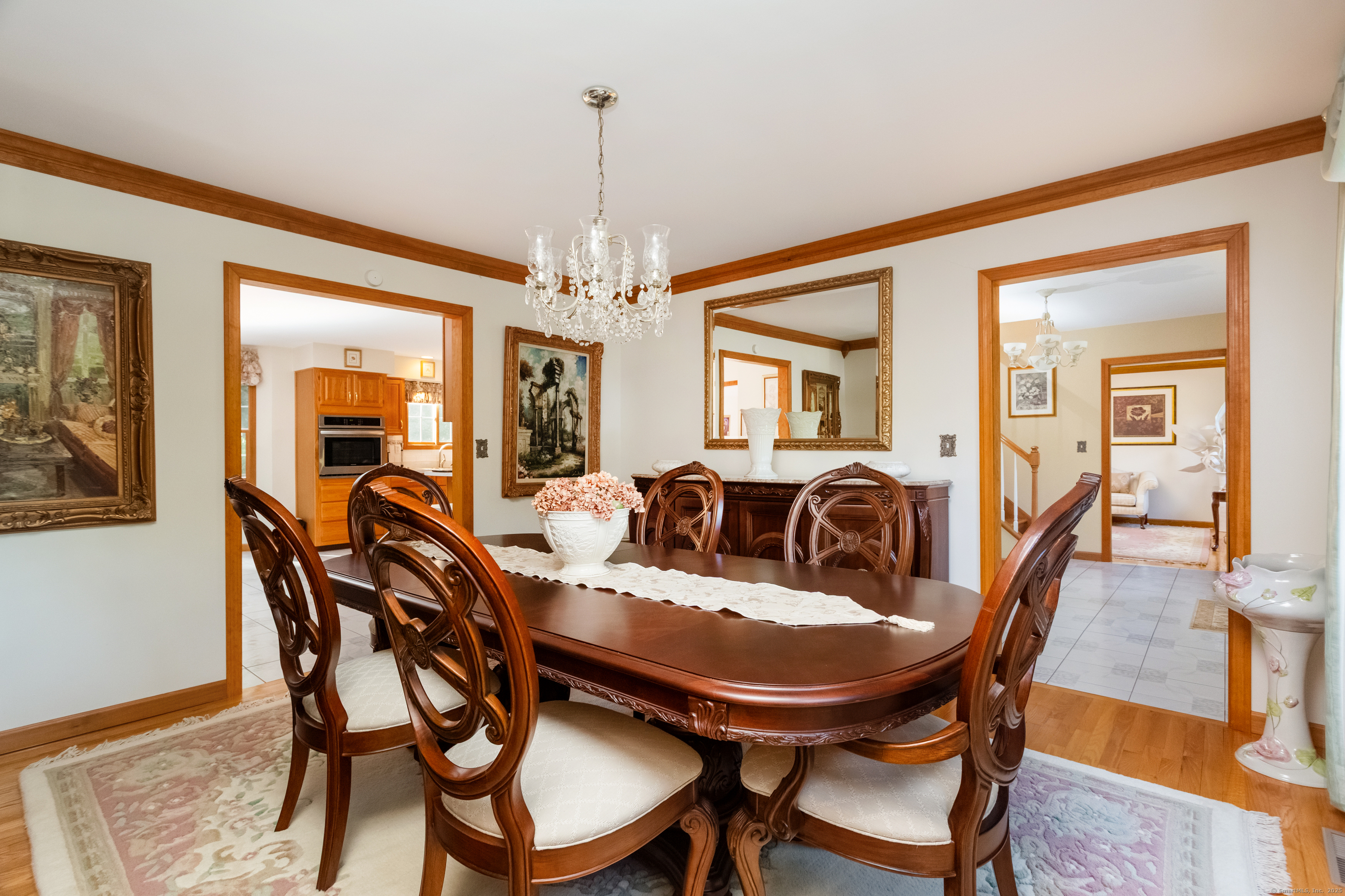 491 Hammertown Road Monroe, CT 06468 - Photo 18 of 40 a view of a dining room with furniture and chandelier