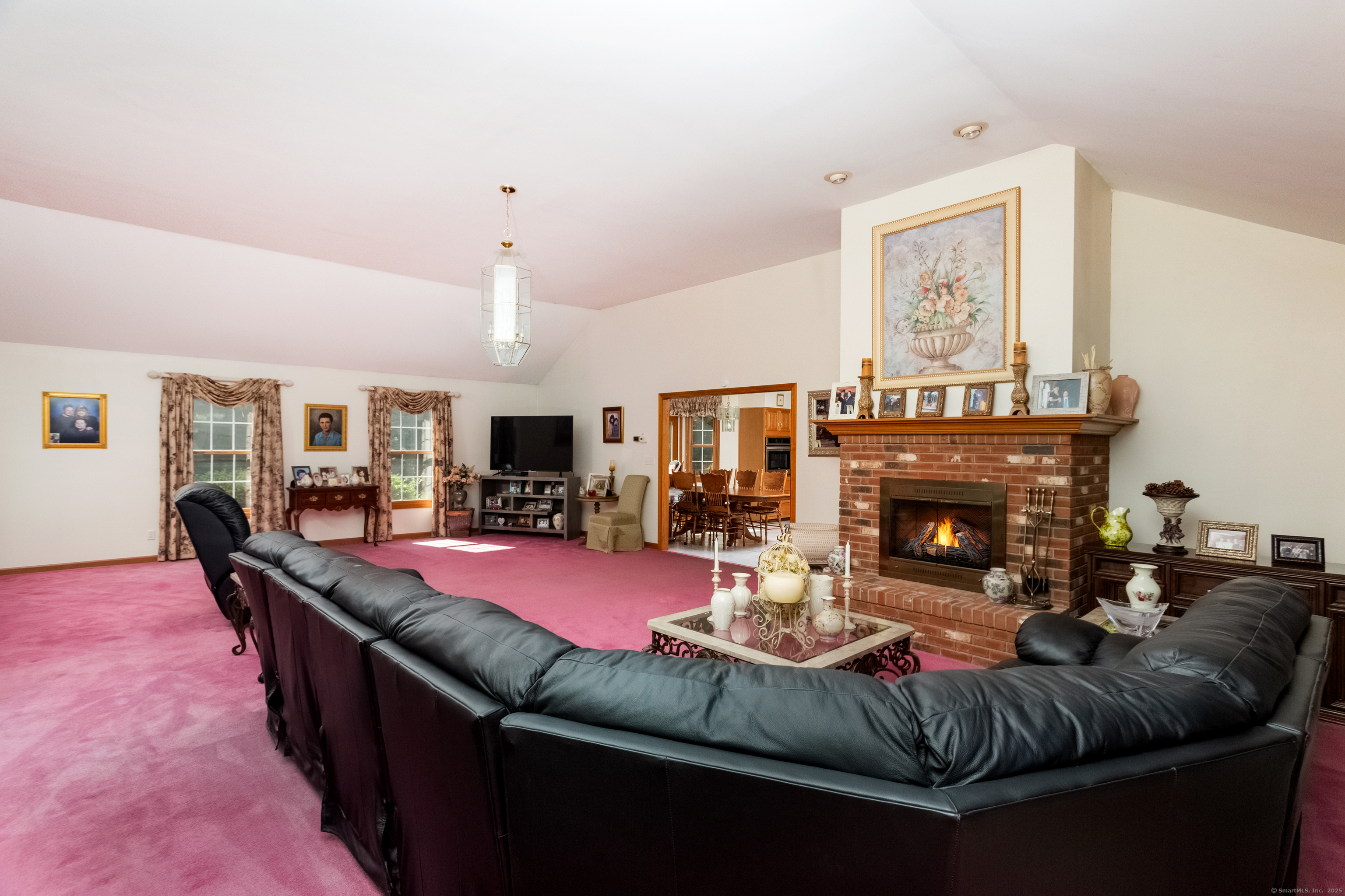 491 Hammertown Road Monroe, CT 06468 - Photo 22 of 40 a living room with furniture and a fireplace