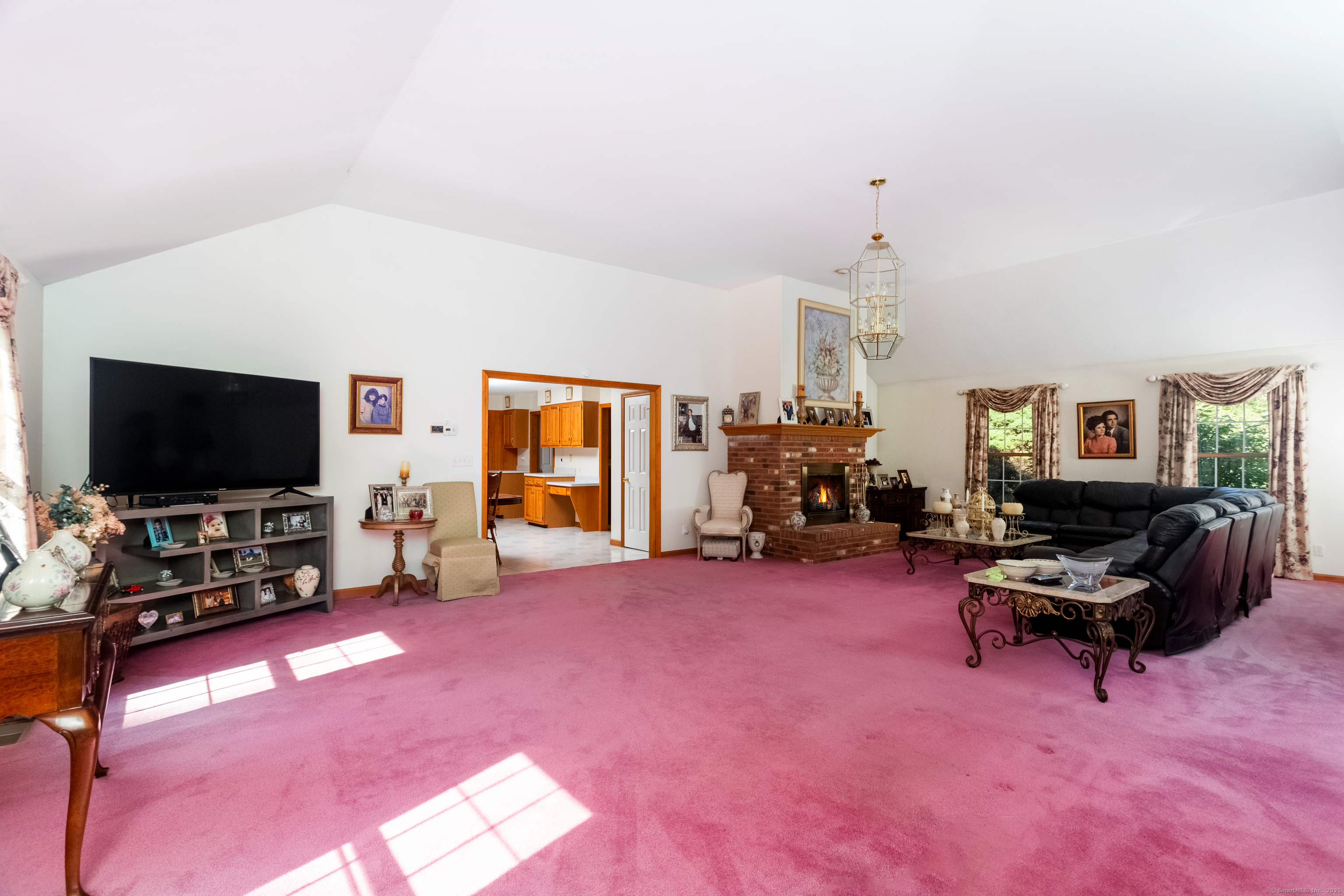 491 Hammertown Road Monroe, CT 06468 - Photo 23 of 40 a living room with furniture and a flat screen tv