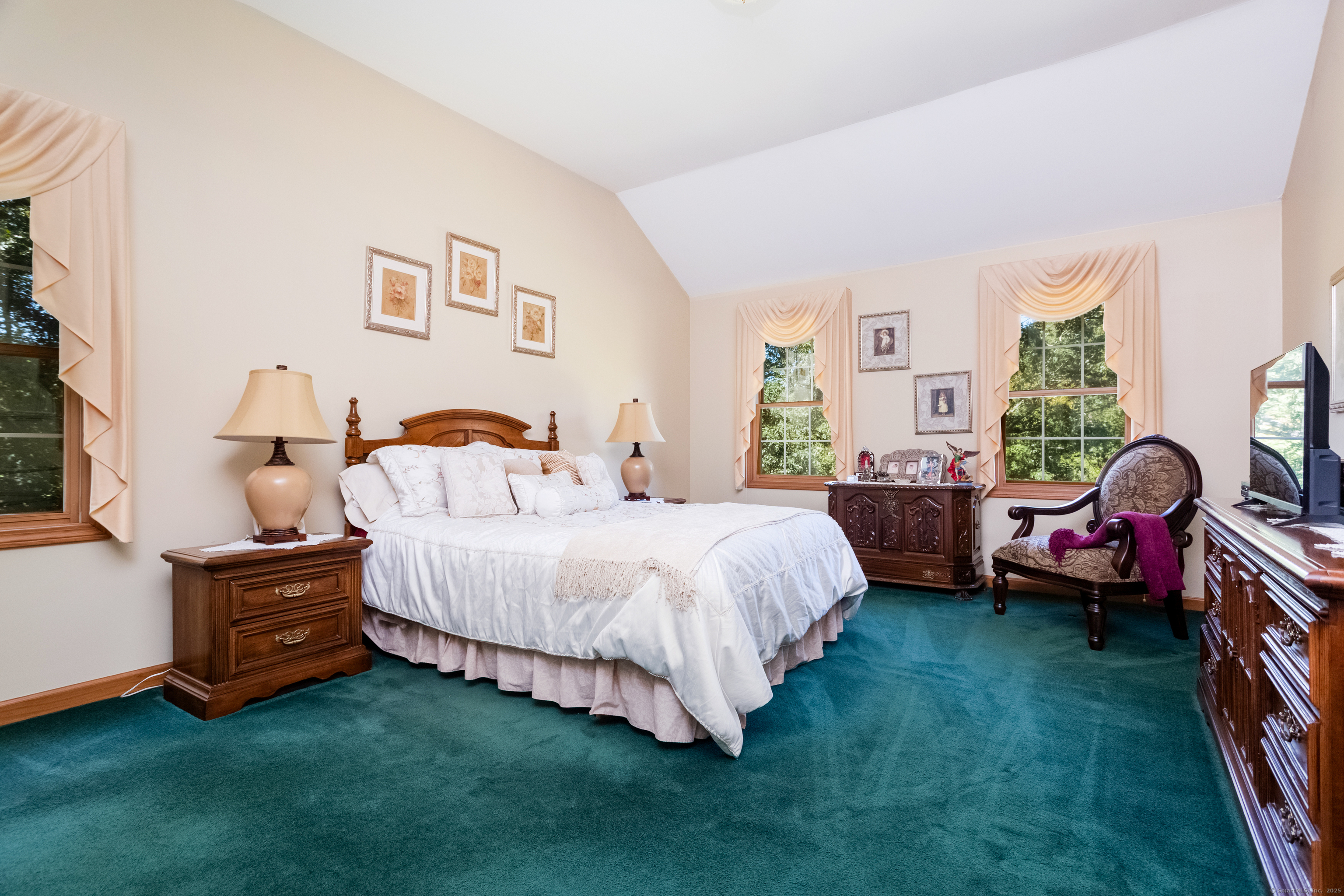 491 Hammertown Road Monroe, CT 06468 - Photo 26 of 40 a spacious bedroom with a bed and a window