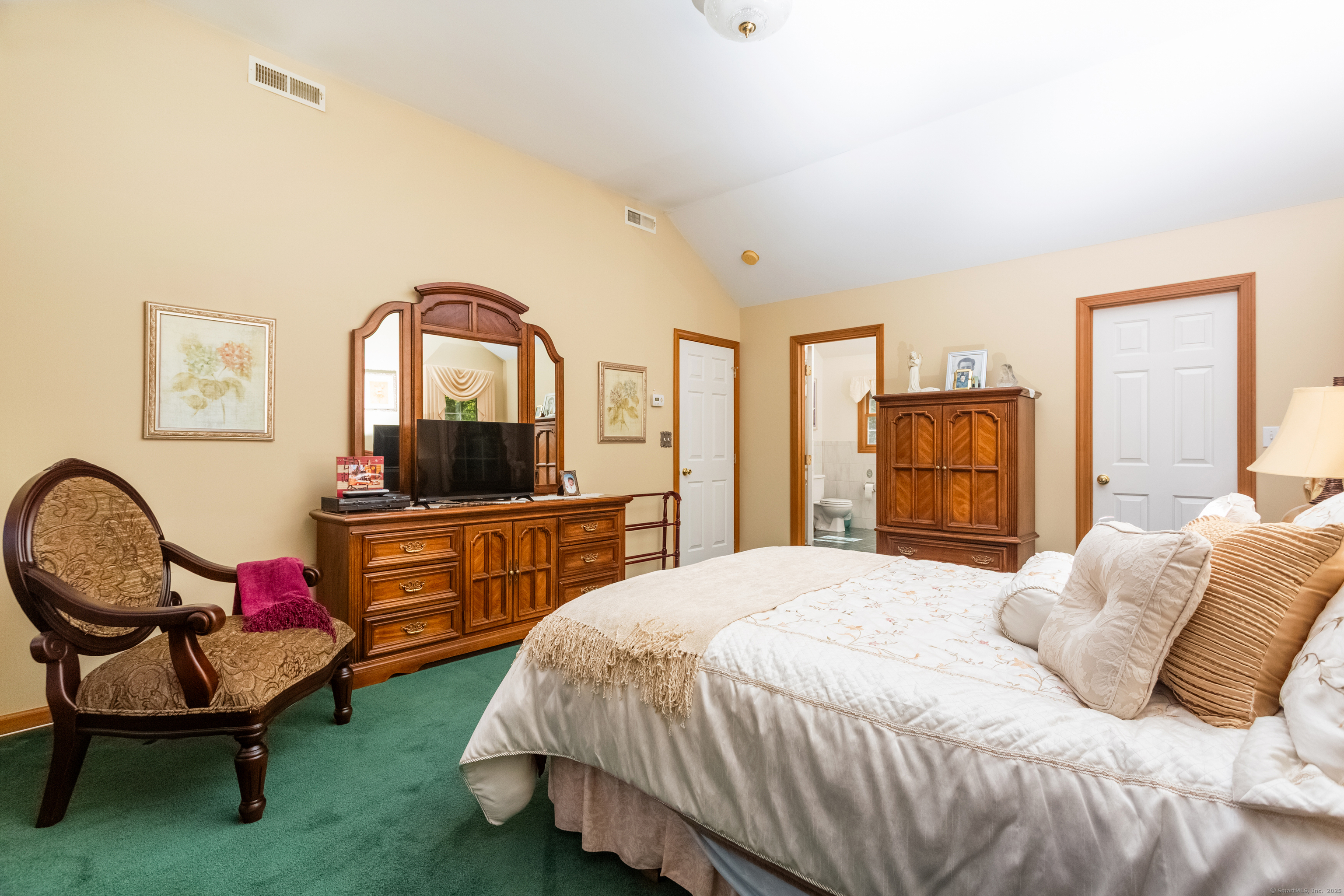 491 Hammertown Road Monroe, CT 06468 - Photo 28 of 40 a bedroom with a bed a dresser and chair