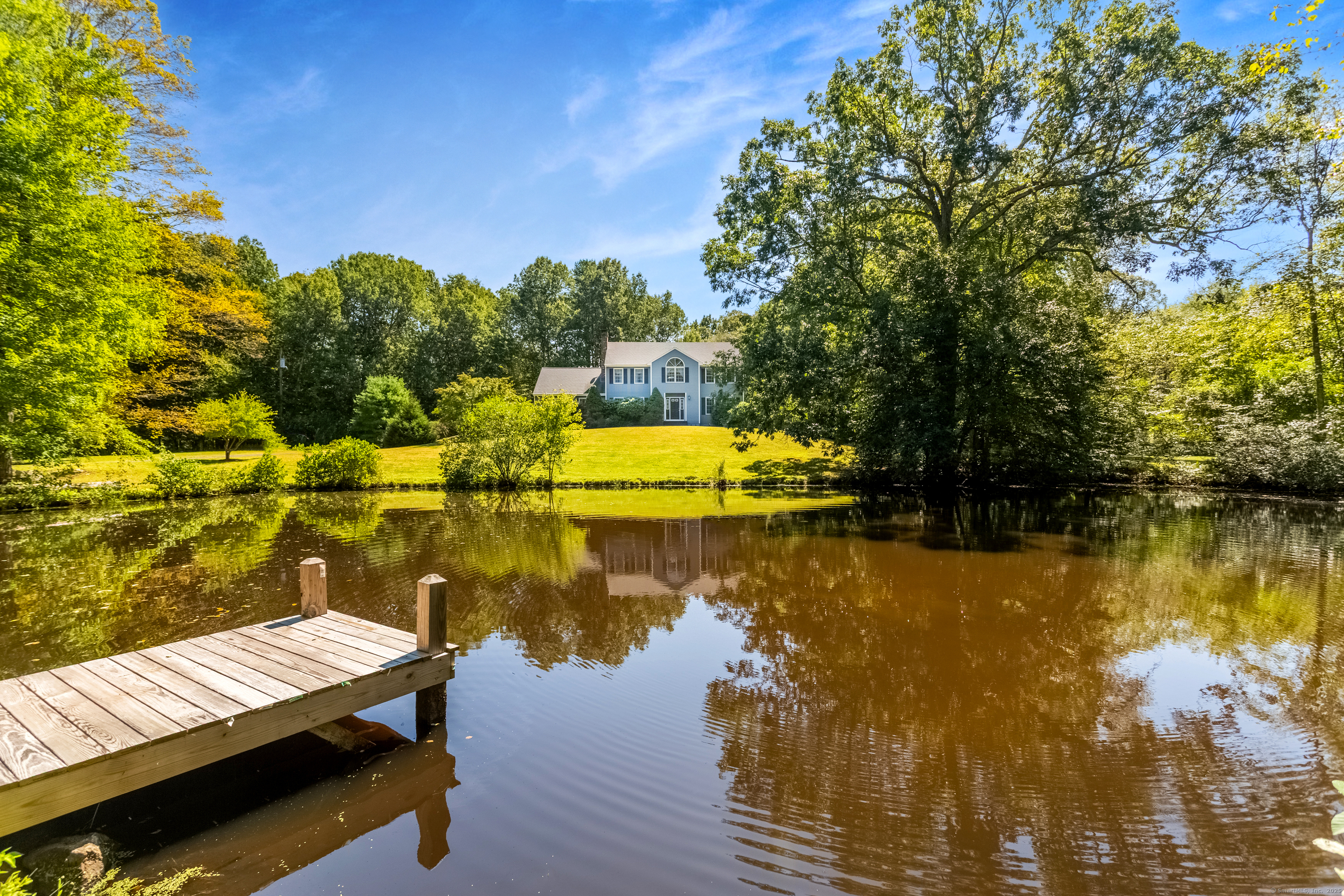 491 Hammertown Road Monroe, CT 06468 - Photo 3 of 40 a view of a lake with chairs