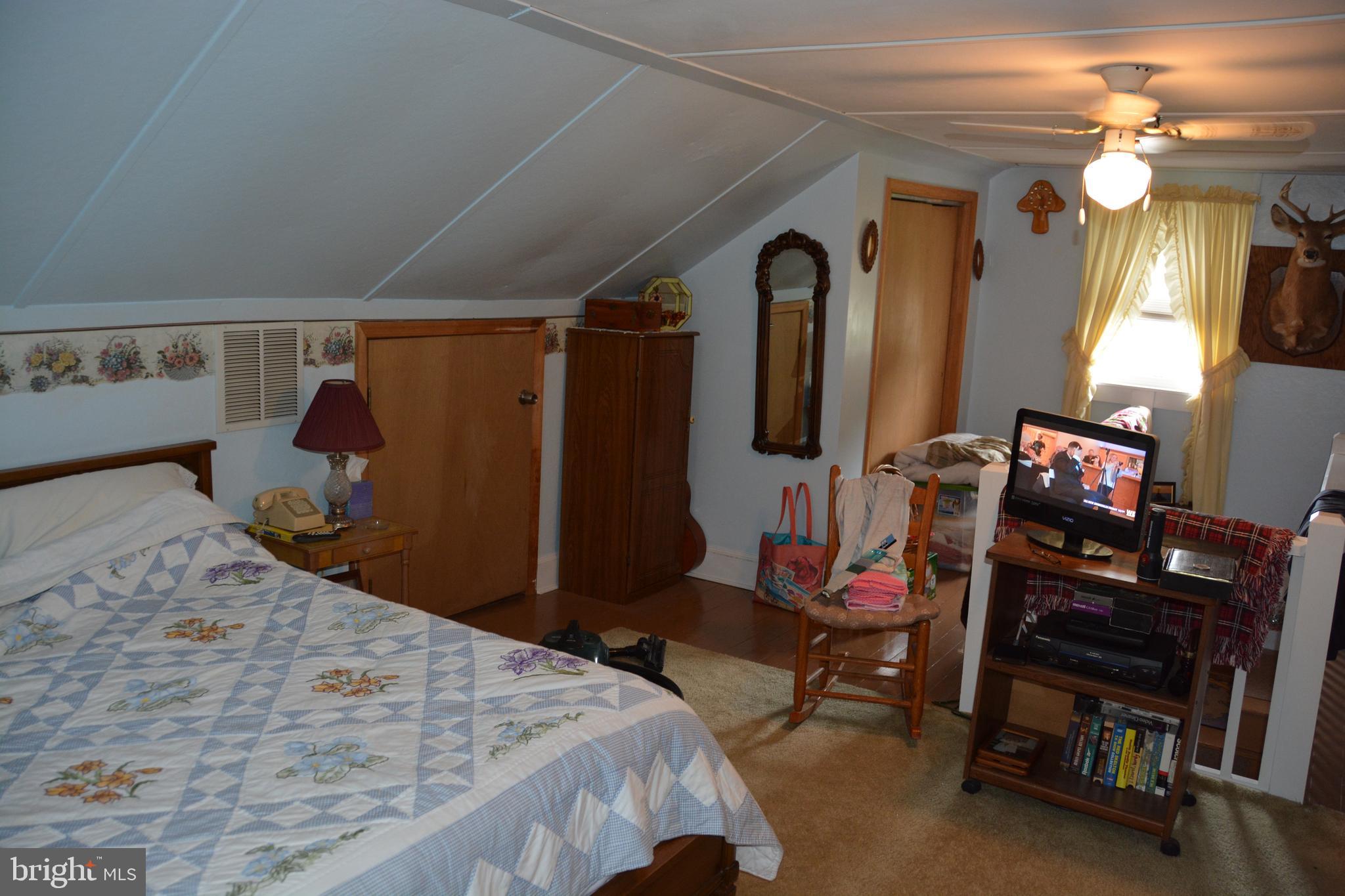 759 Round Hill Road Winchester, VA 22602 - Photo 25 of 70 Upper level bedroom. Storage under the eaves