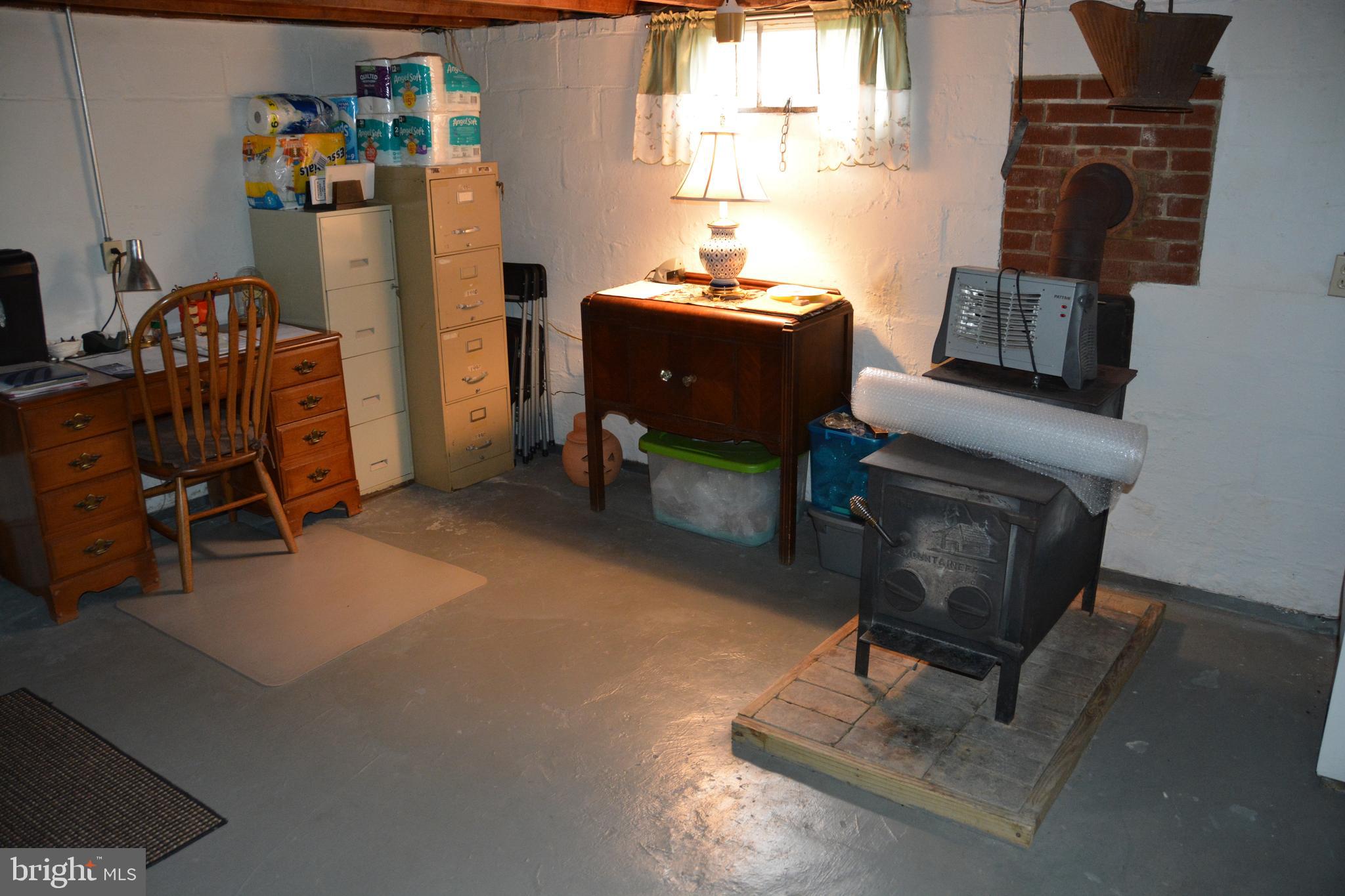 759 Round Hill Road Winchester, VA 22602 - Photo 28 of 70 Basement, clean, dry, w/woodstove