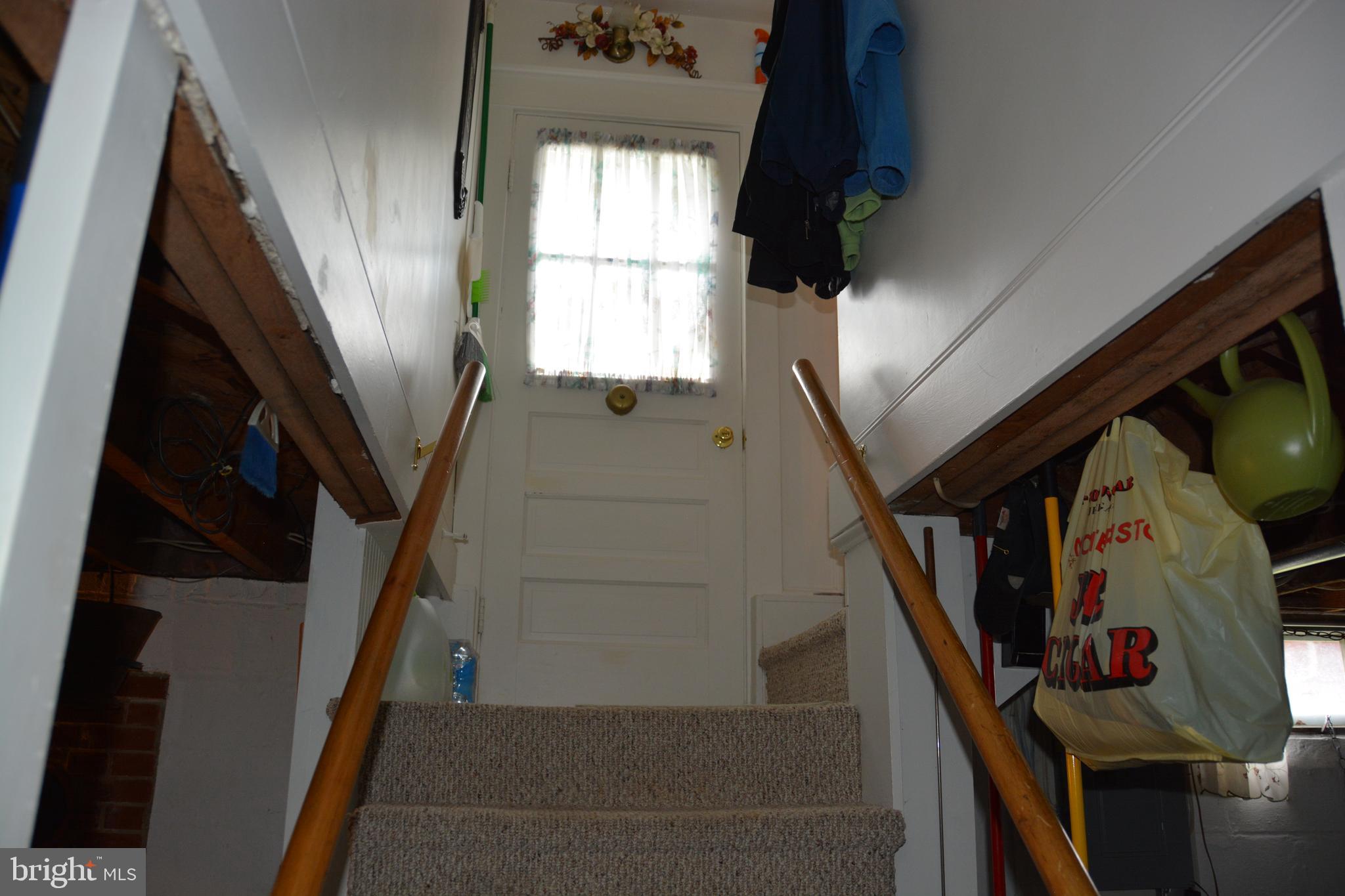 759 Round Hill Road Winchester, VA 22602 - Photo 36 of 70 Stairs from basement to landing & outside entrance