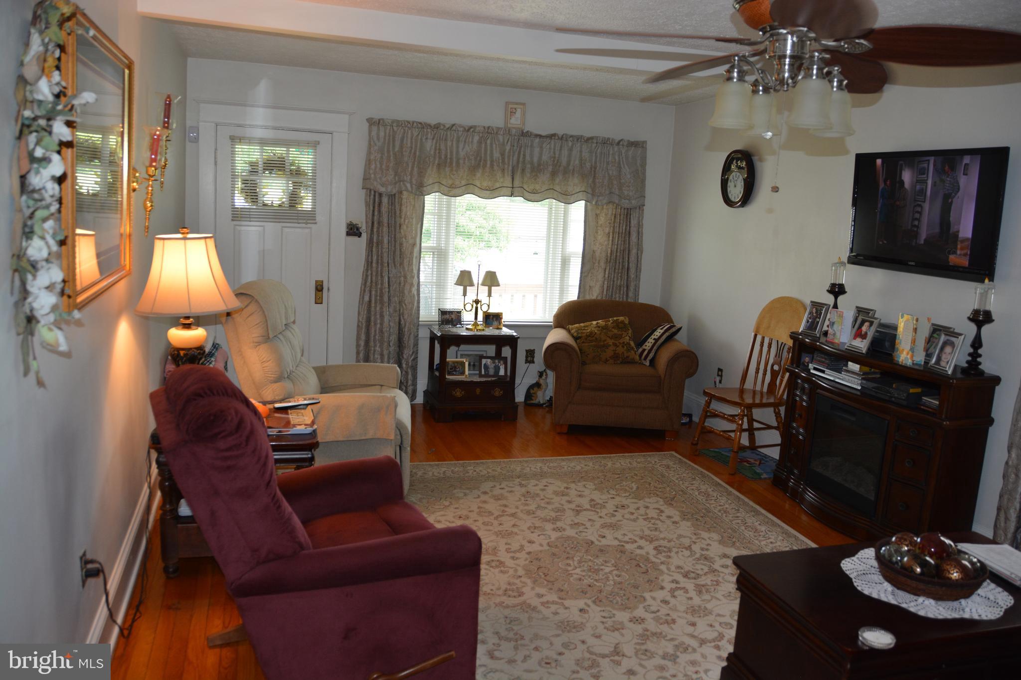 759 Round Hill Road Winchester, VA 22602 - Photo 6 of 70 Spacious living room has hardwood flooring