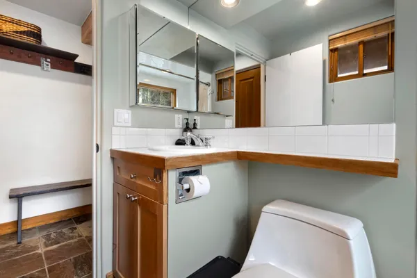 a bathroom with a sink and a mirror