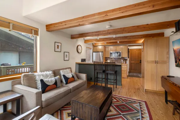 a living room with furniture and a table
