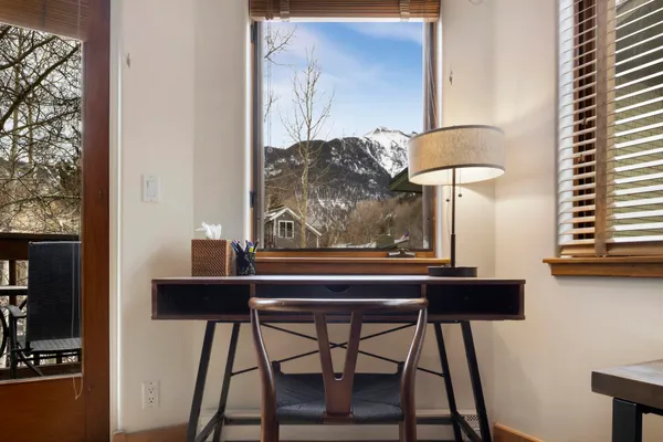 a view of a chairs and table in a kitchen