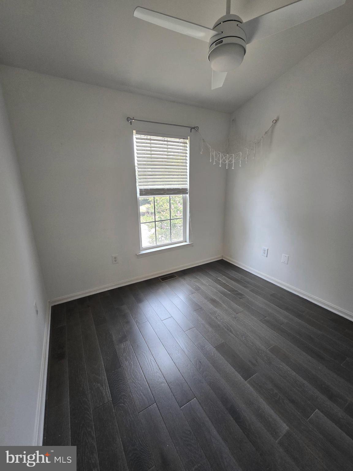 11847 Skylark Road Clarksburg, MD 20871 - Photo 20 of 46 wooden floor in an empty room with a window