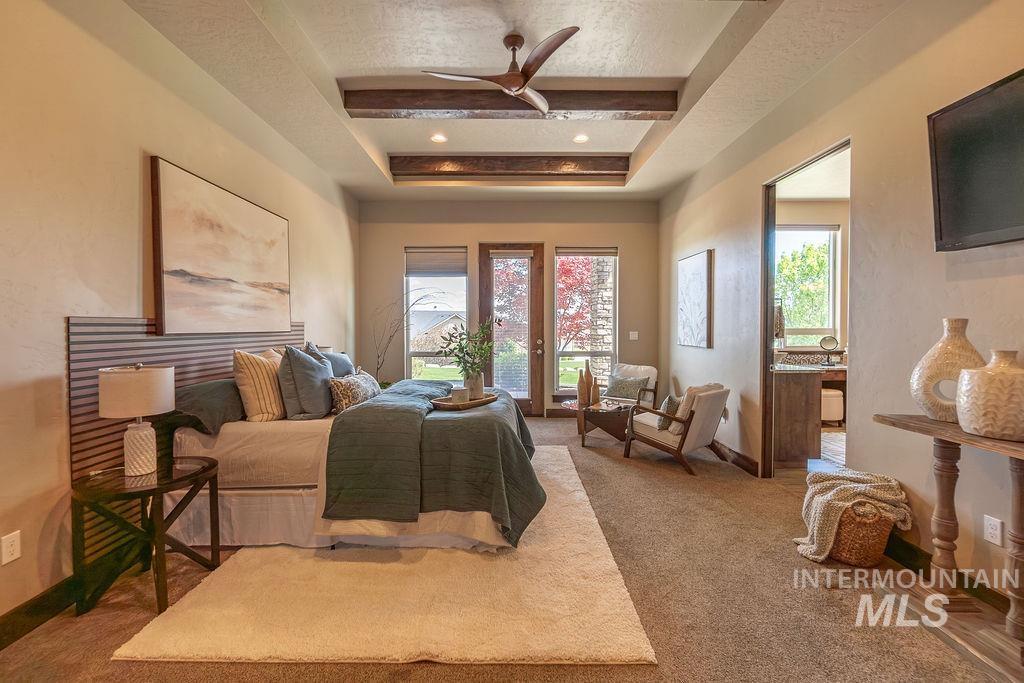 15350 Syrah Court Caldwell, ID 83607 - Photo 27 of 50 Bedroom featuring wood-beamed tray ceiling with recessed lighting and ceiling fan