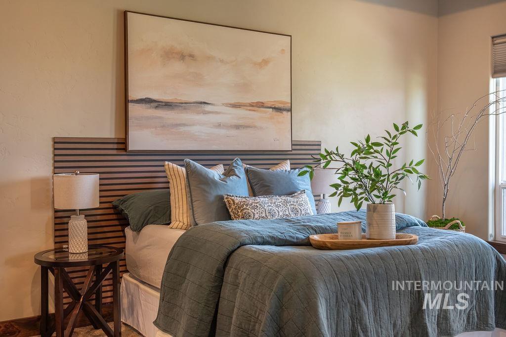 15350 Syrah Court Caldwell, ID 83607 - Photo 30 of 50 Bedroom featuring a slatted wood-finish accent wall and neutral-toned wall finishes