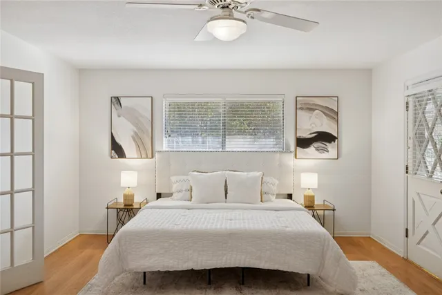 a bedroom with a bed and window