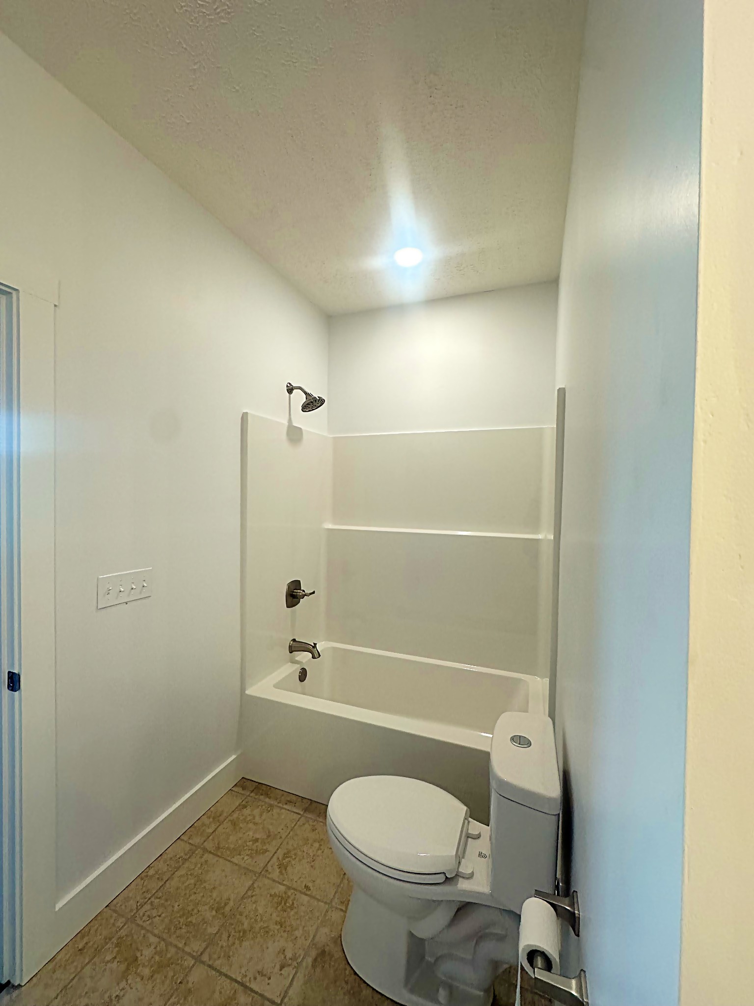 821 Alman Cemetery Road Paris, TN 38242 - Photo 20 of 32 a bathroom with a granite countertop toilet and a shower