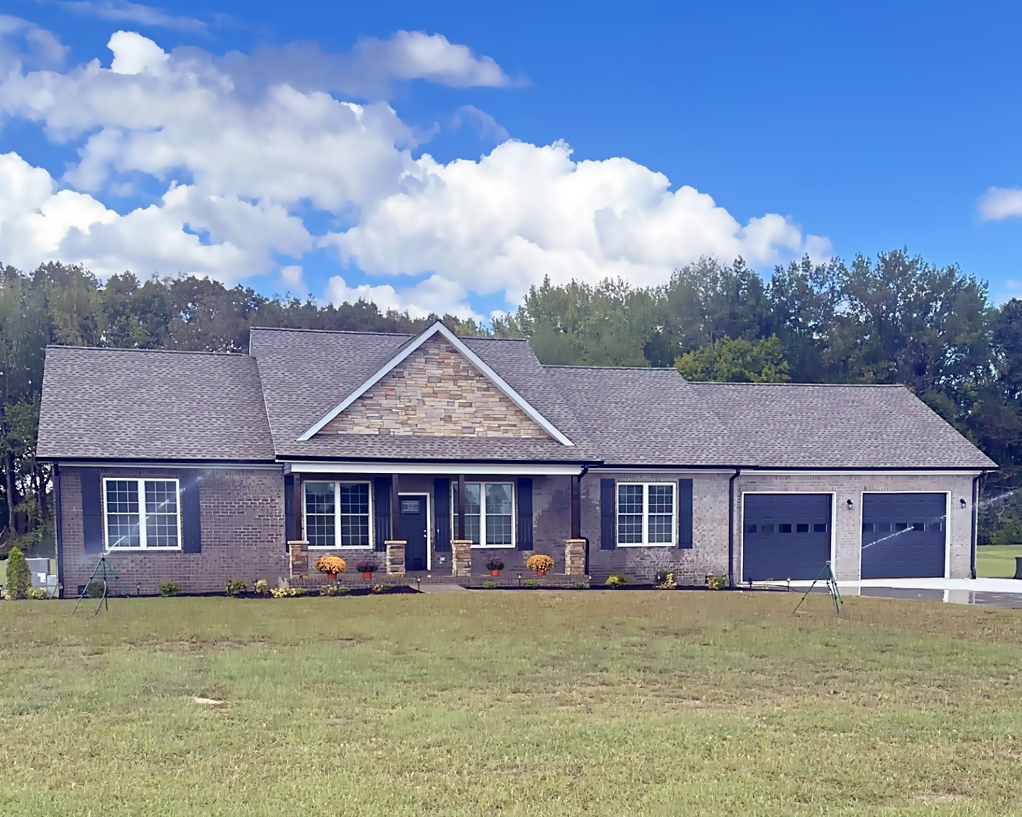 821 Alman Cemetery Road Paris, TN 38242 - Photo 2 of 32 a view of a big house with a big yard and large trees