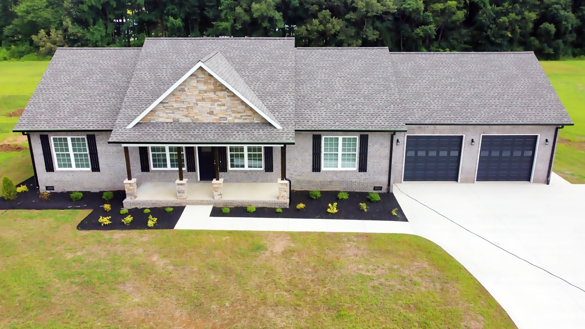 821 Alman Cemetery Road Paris, TN 38242 - Photo 3 of 32 a house view with a garden space