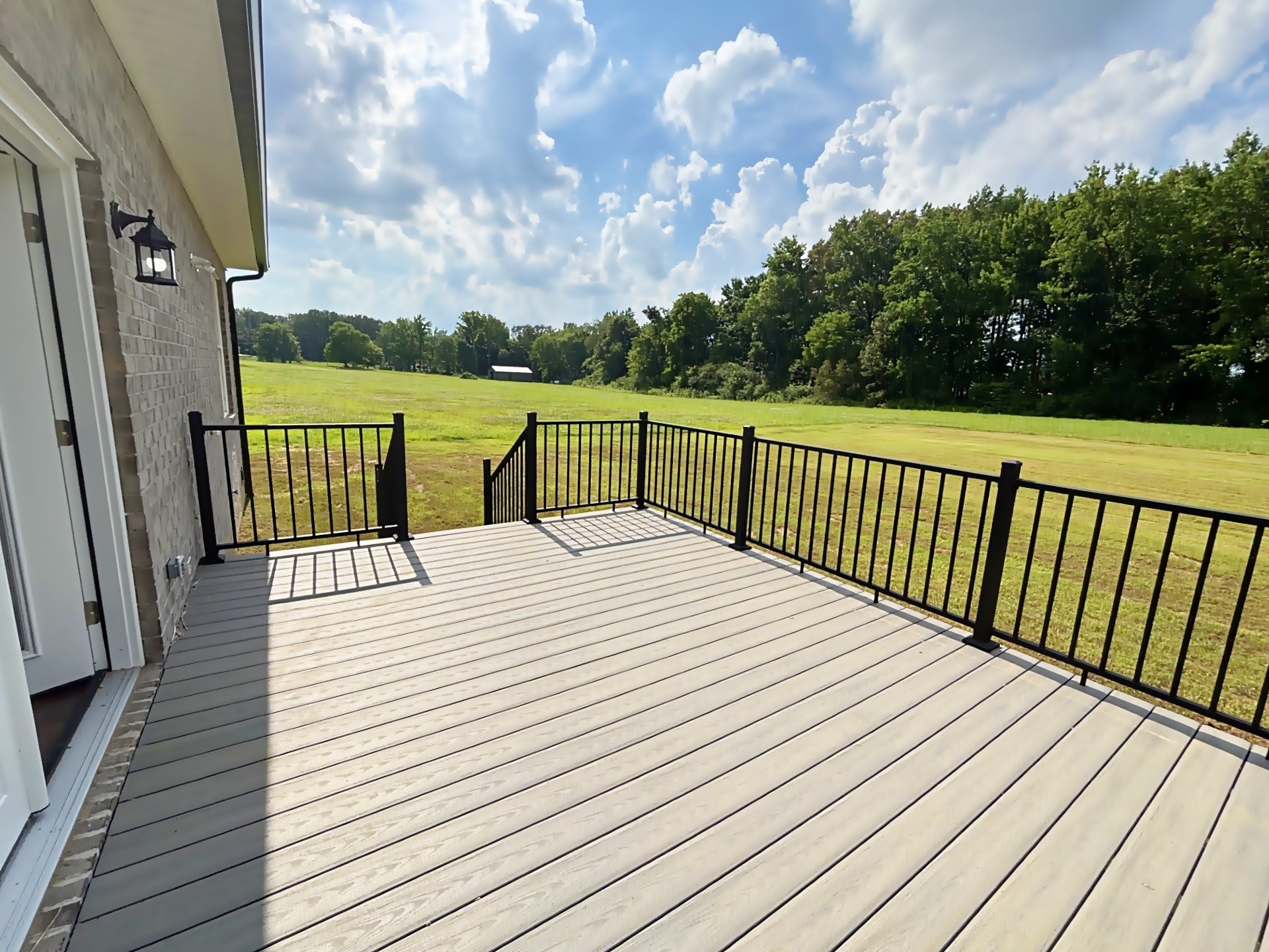 821 Alman Cemetery Road Paris, TN 38242 - Photo 31 of 32 a view of balcony with wooden floor and fence