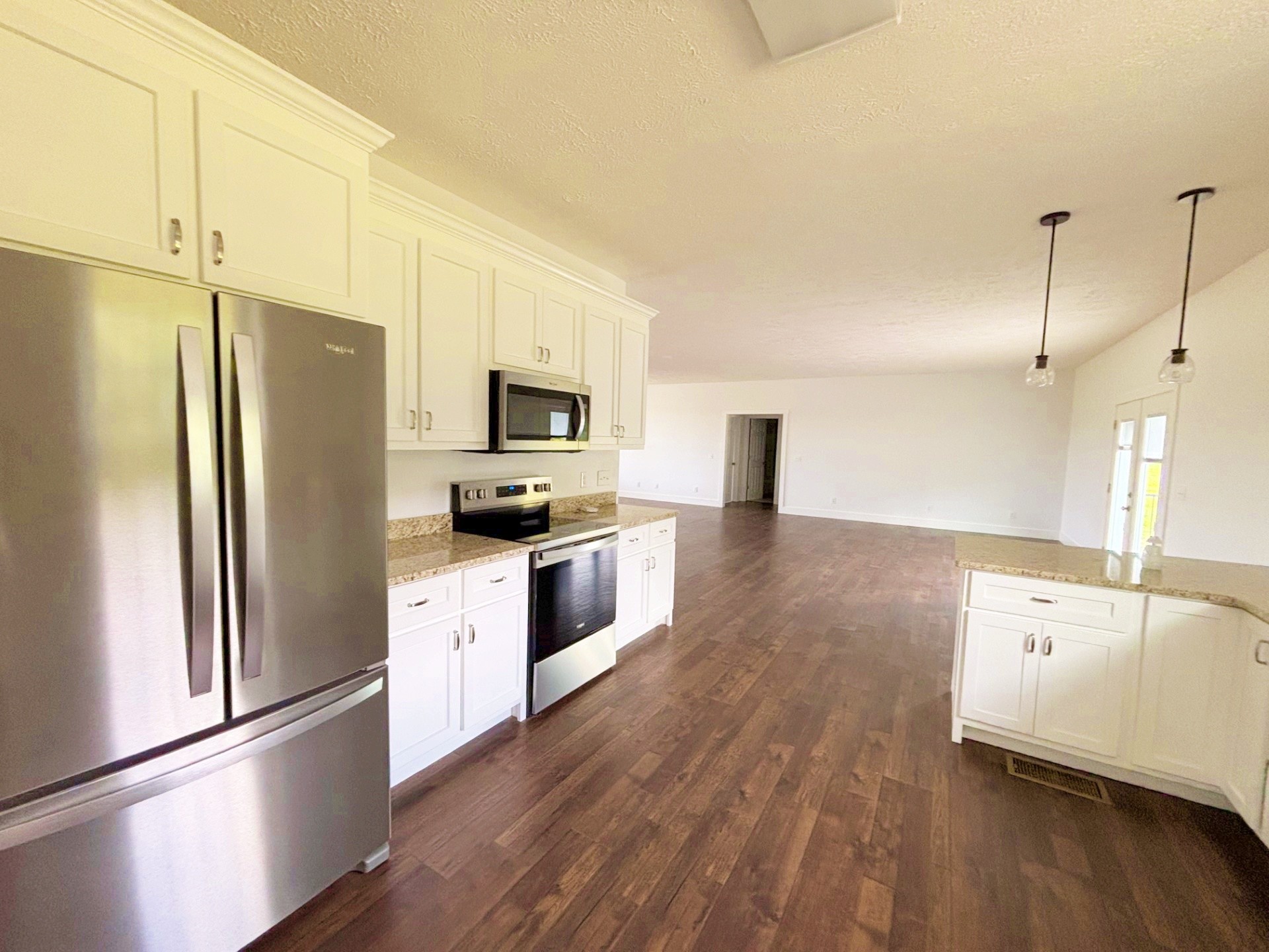 821 Alman Cemetery Road Paris, TN 38242 - Photo 8 of 32 a kitchen with stainless steel appliances a refrigerator sink and microwave