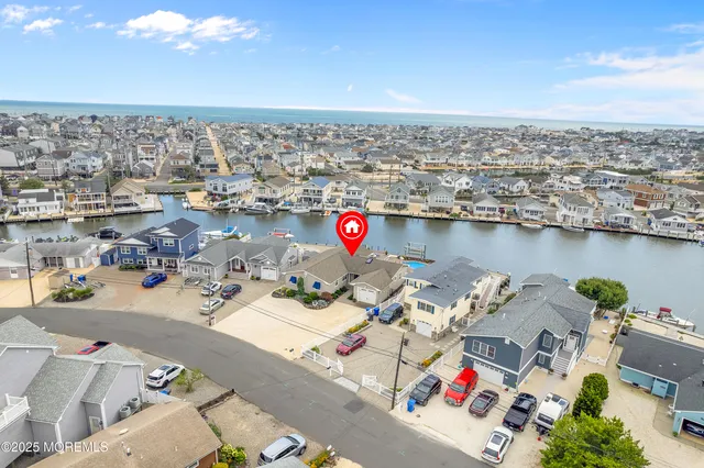 a view of a dining room with furniture wooden floor and chandelier