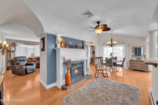 a kitchen with stainless steel appliances granite countertop a sink a stove and a refrigerator