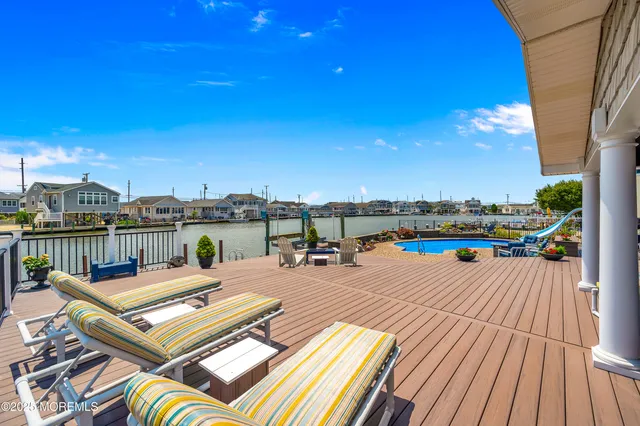 a view of a house with pool porch and sitting area