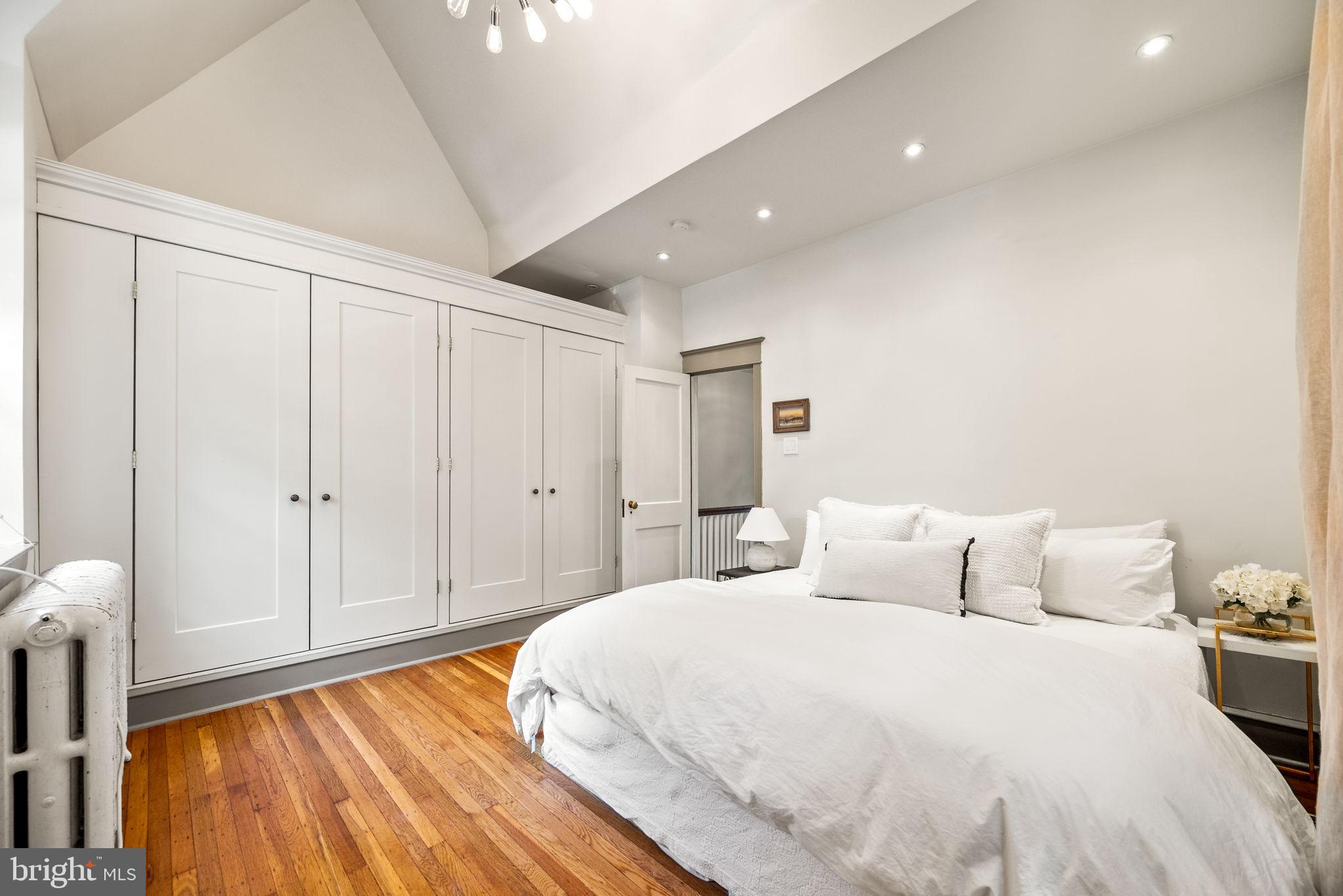 3310 West Penn Street Philadelphia, PA 19129 - Photo 13 of 26 a bedroom with a bed and a table