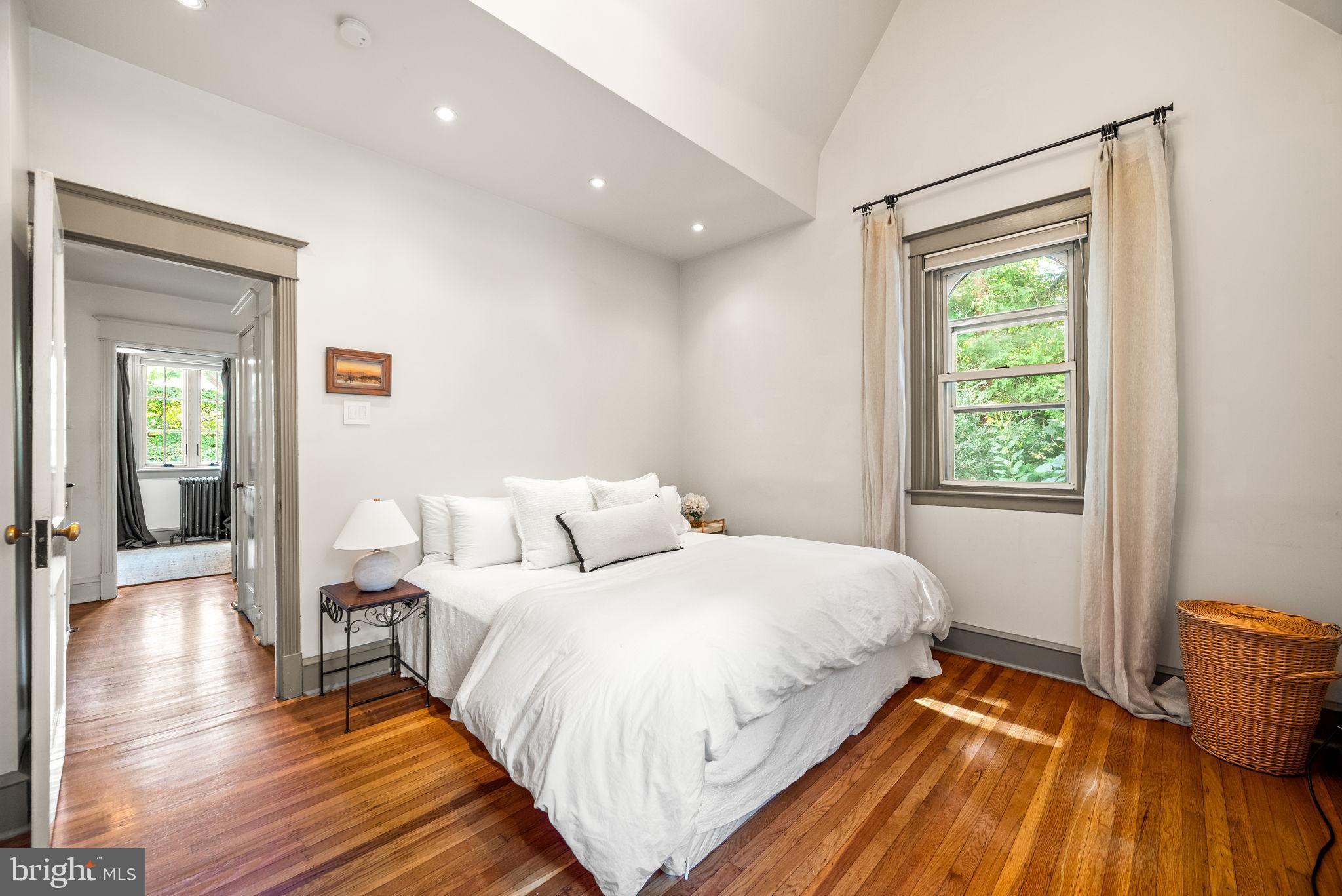 3310 West Penn Street Philadelphia, PA 19129 - Photo 14 of 26 a bedroom with a bed and wooden floor