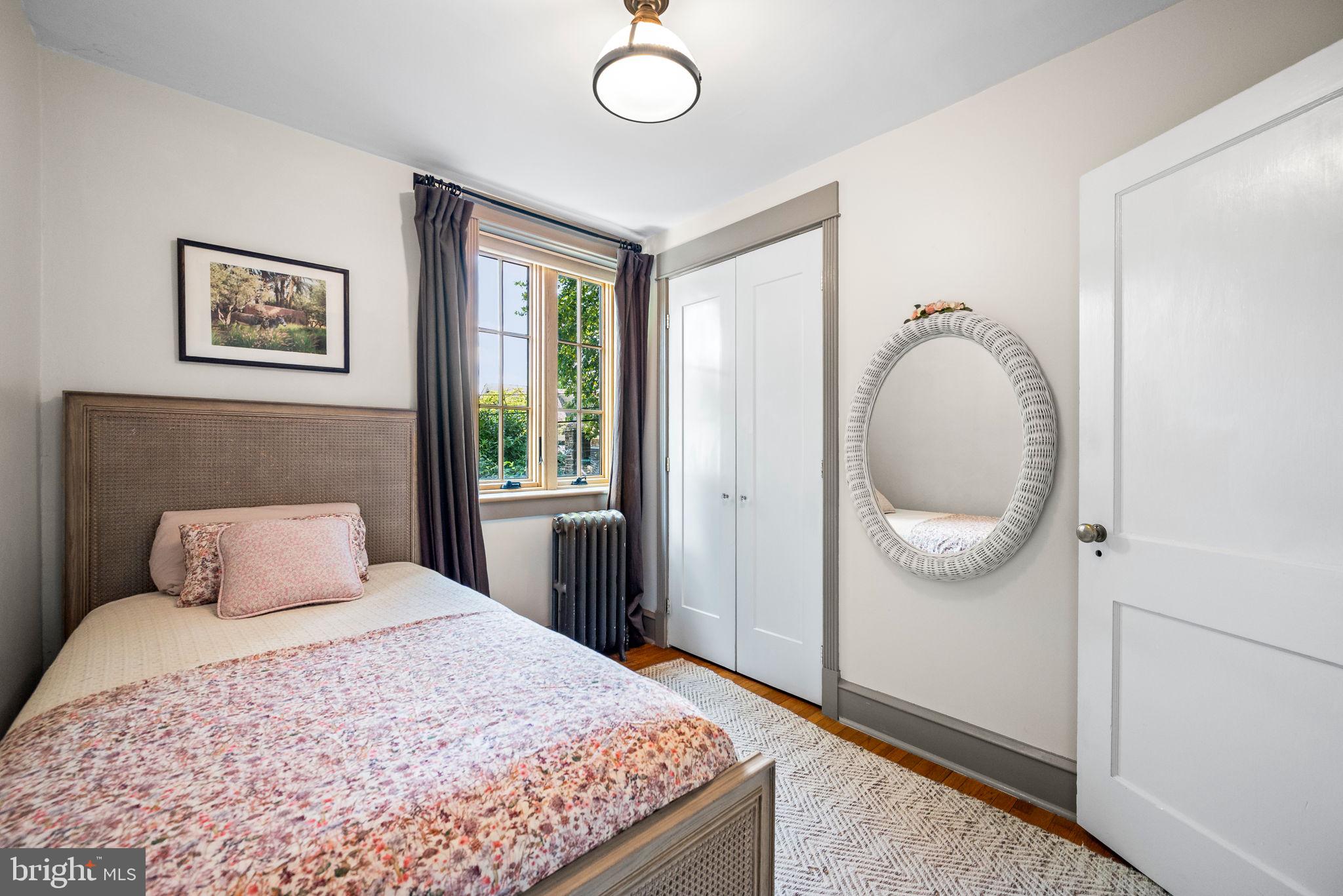 3310 West Penn Street Philadelphia, PA 19129 - Photo 16 of 26 a bedroom with a large bed and a window