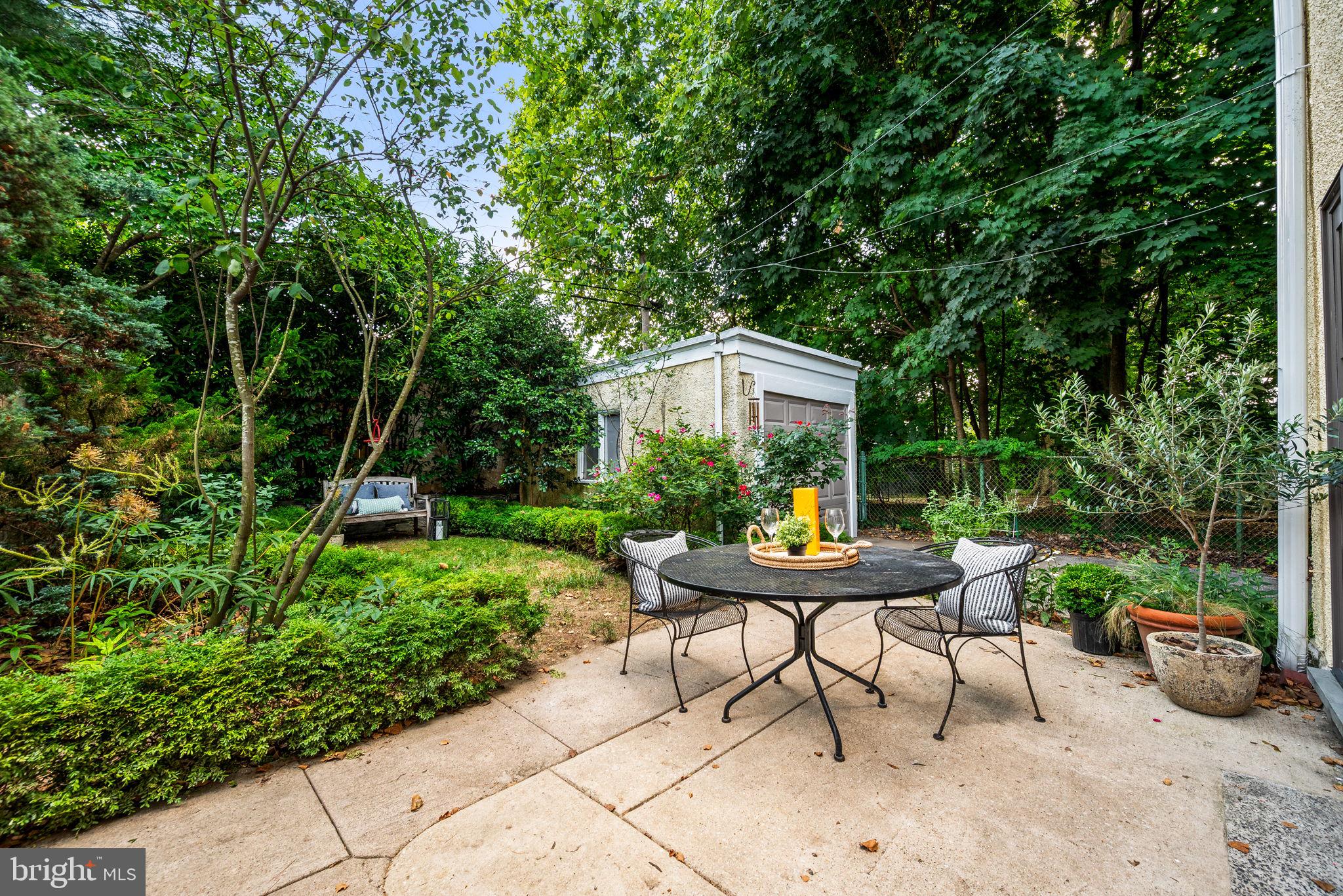 3310 West Penn Street Philadelphia, PA 19129 - Photo 19 of 26 a view of a house with backyard sitting area and garden