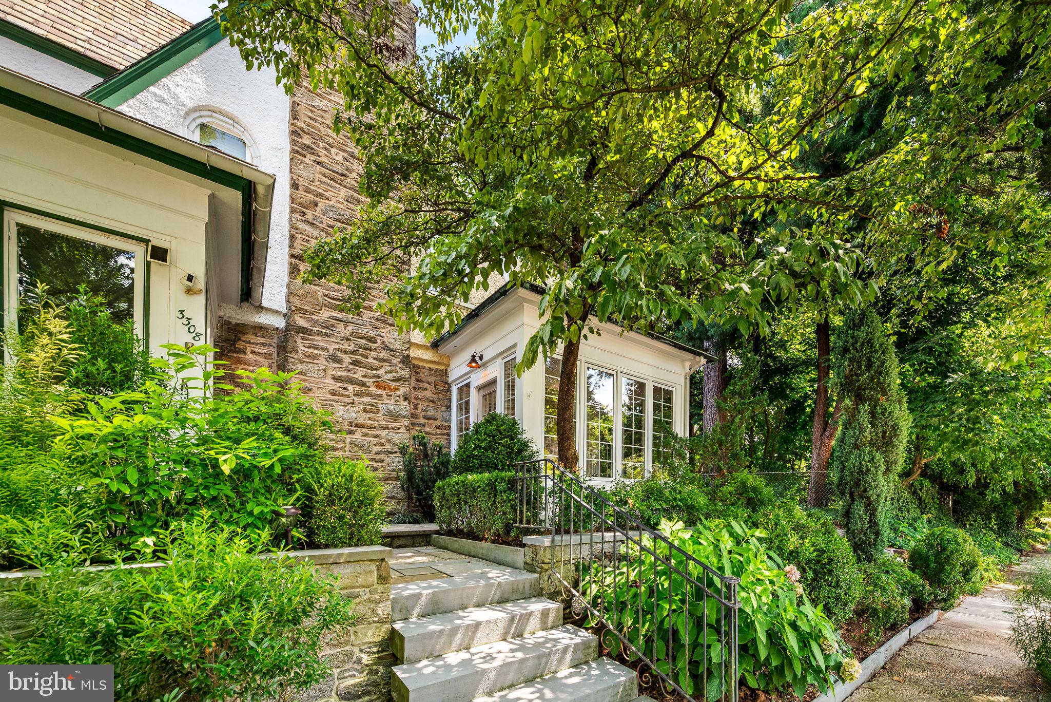 3310 West Penn Street Philadelphia, PA 19129 - Photo 2 of 26 a front view of a house with a garden