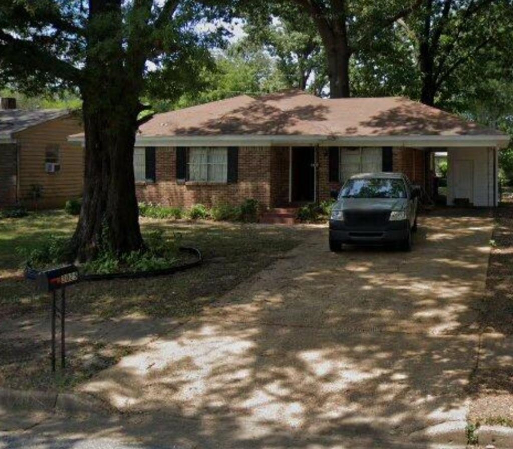 3025 Cherry Road Memphis, TN 38118 - Photo 1 of 1 a front view of a house with a garden