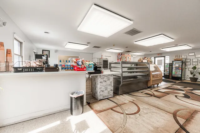 a kitchen with a sink a stove and cabinets