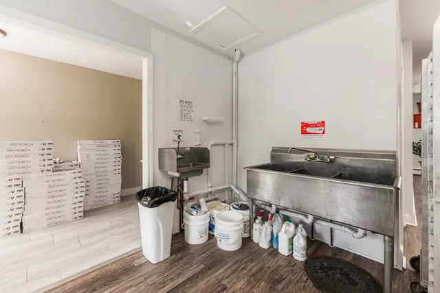 a kitchen with a sink and a stove top oven