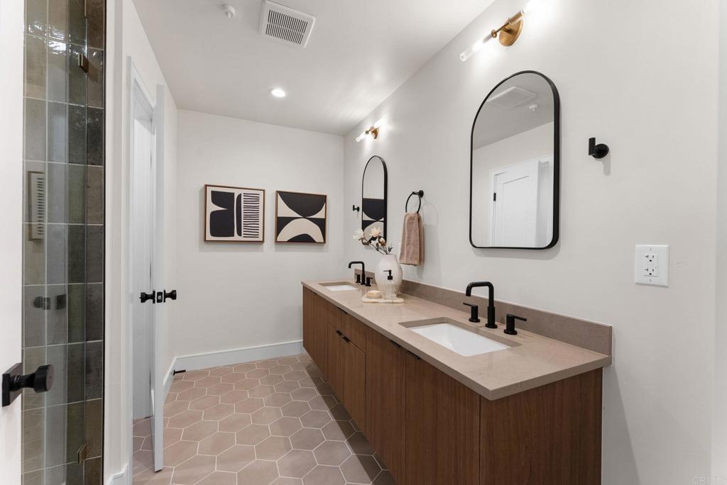 4200 Tonopah Avenue San Diego, CA 92110 - Photo 15 of 25 a bathroom with a sink and a mirror
