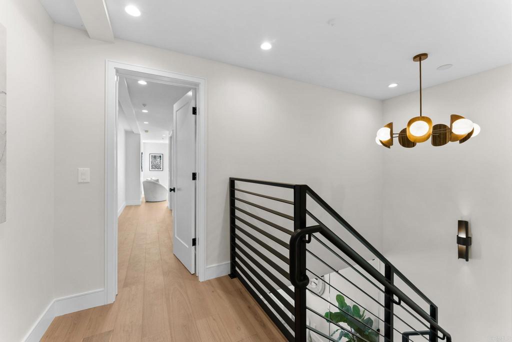 4200 Tonopah Avenue San Diego, CA 92110 - Photo 17 of 25 a view of a hallway with wooden floor
