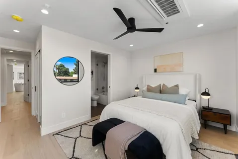 a bathroom with a toilet sink and shower