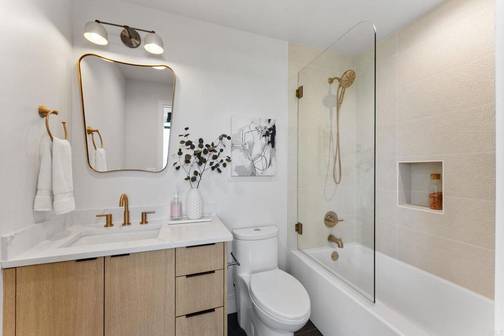 4200 Tonopah Avenue San Diego, CA 92110 - Photo 20 of 25 a bathroom with a toilet sink and shower