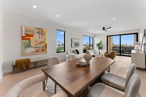 a view of a livingroom with furniture and a potted plant